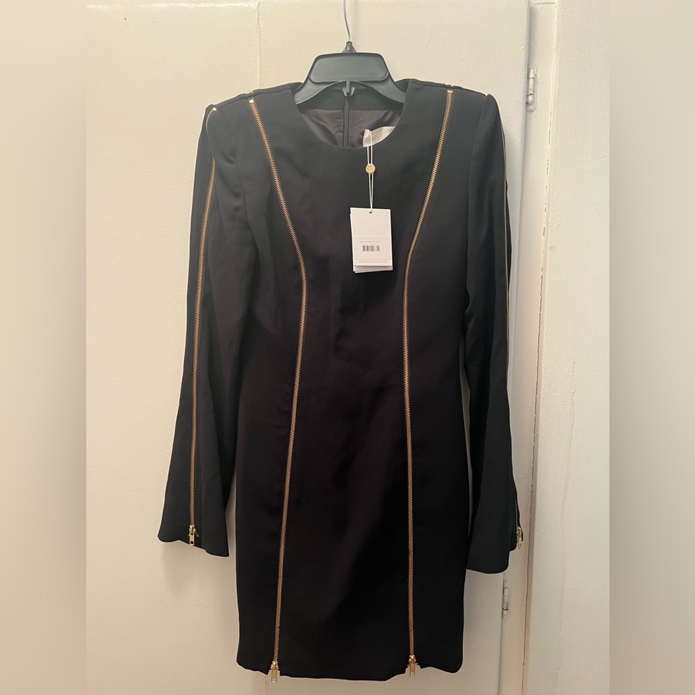 Brand New Misha Collection black dress with padded shoulders Size 4 with tags on